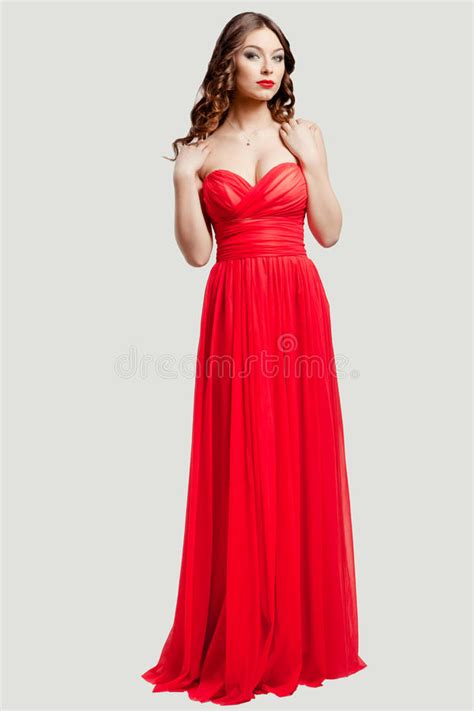 Beautiful Female Fashion Model In Red Dress Stock Photo