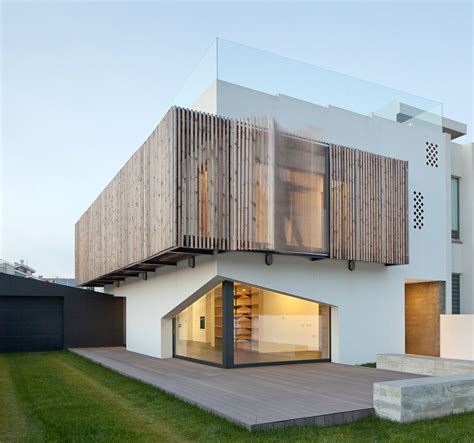 E348 Arquitectura Screens House In Miramar With Operable Facade