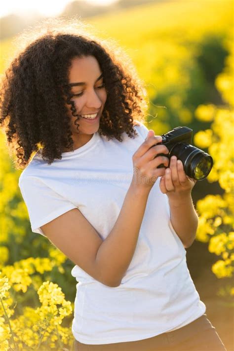 Beautiful Mixed Race African American Girl Teenager Using Camera Stock