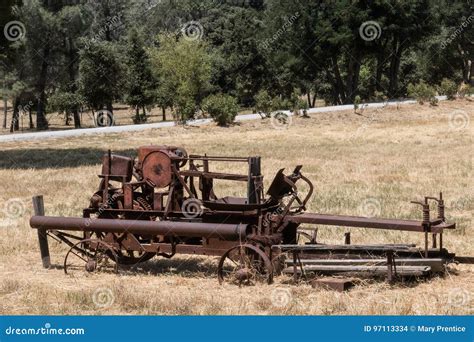 Rusty Vintage Farm Machine In Field Of Dry Grass Stock Photo Image Of