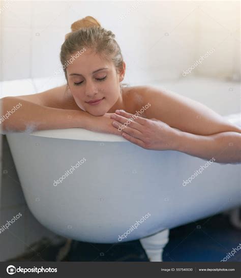 The Best Way To Unwind After A Long Week Shot Of Beautiful Young Woman Relaxing In The Bathtub