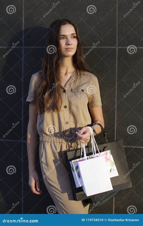 Beautiful Woman Goes Shopping In The City Stock Photo Image Of Beautiful Dress