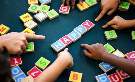 Premium Photo Kids Spelling Out Words With Alphabet Blocks