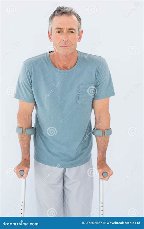 Portrait Of A Mature Man With Crutches Stock Image Image Of Quarter
