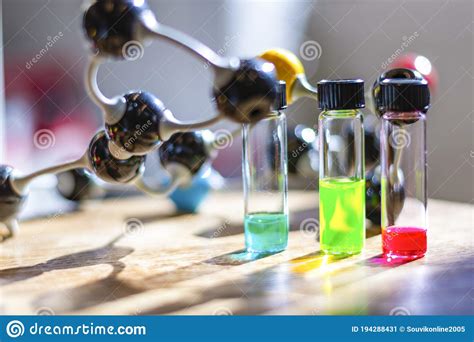 Multicolour Solutions In Different Vials Under The Light With Molecule