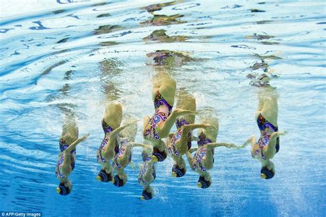 Underwater Photographs Show Synchronised Swimmers Competing At European