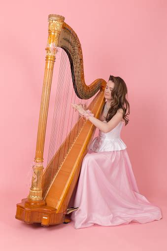 Girl Playing The Harp Stock Photo Download Image Now Istock