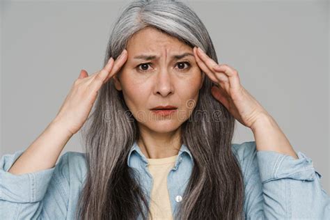 Unhappy White Haired Woman With Headache Rubbing Her Temples Stock Photo Image Of People