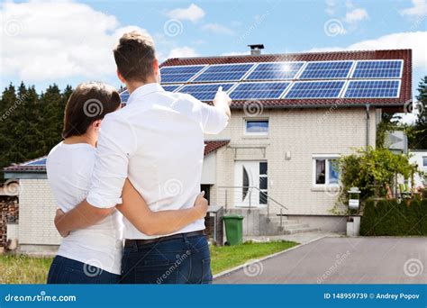 Couple Standing In Front Of Their New House Stock Image Image Of