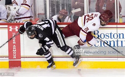 Ron Greco Of The Boston College Eagles Is Checked Into The Boards By