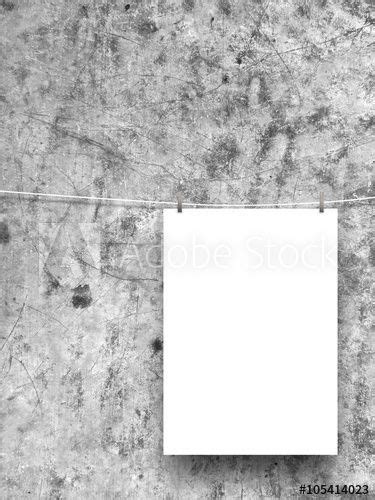Close Up Of One Hanged Paper Sheet With Pegs On Rusty And Scratched Metal Background Acquista