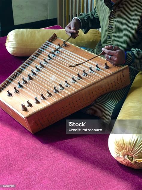 Image Of Indian Musician Playing Santoor Instrument With Strings Like