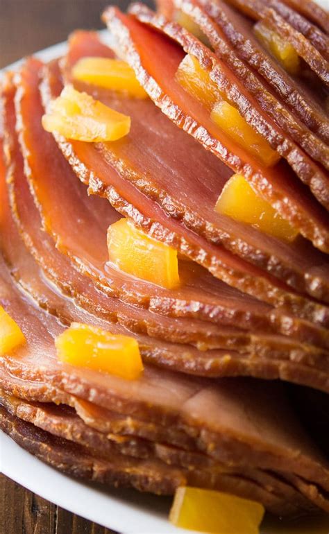 This 4 ingredient pineapple brown sugar glaze makes a regular spiral sliced ham taste completely amazing. Crock Pot Brown Sugar Pineapple Ham Recipe - Slow Cooker Ham