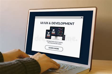 Uiux Design And Development Concept On Laptop Screen On Wooden Table