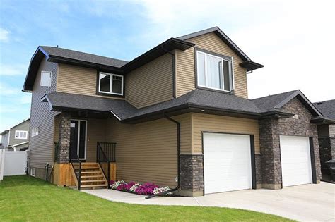 It's the ventilation support you need to protect your home from extreme. Kaycan Vinyl Siding (Pecan Siding with Black Trim and Grey ...