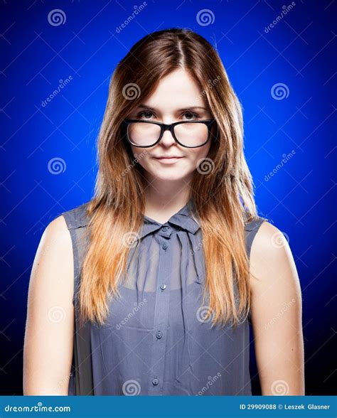 Disappointed Young Girl Looking Through The Nerd Glasses Royalty Free