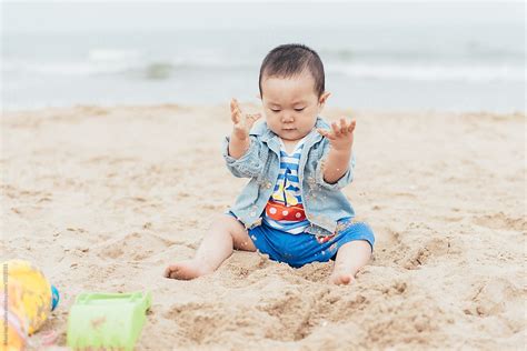 Cute Baby Playing In Sand Del Colaborador De Stocksy Maahoo Stocksy