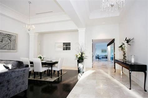 Temmer marble and stylish design. Travertine marble floor tiles - black white entry living