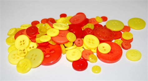 Pack Of 50g Mixed Sizes Of Various Yellow And Orange Buttons