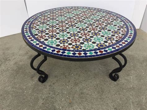 It's made from solid and engineered wood in a distressed black finish. Mosaic Outdoor Round Tile Coffee Table from Morocco at 1stdibs