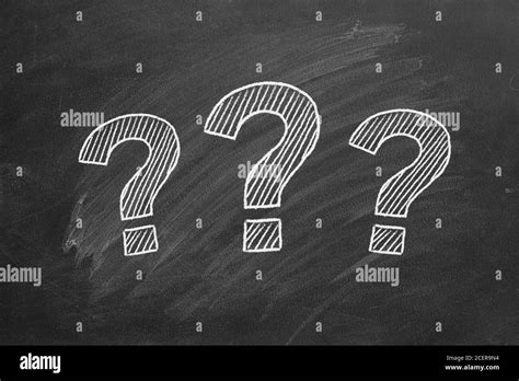 Three Question Marks Drawn In Chalk On A Blackboard Stock Photo Alamy