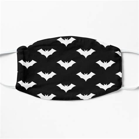 A Black And White Face Mask With Bat Designs On It Designed To Look