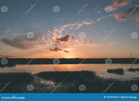 Beautiful Summer Sunset At The River With Blue Sky Red And Oran Stock