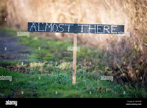 A Homemade Almost There Signpost Giving Directions To The End Or
