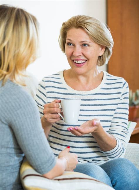 Happy Daughter Sharing Gossips With Mature Mom While Tea Drinking Stock Image Image Of Adult