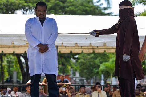 indonesian woman caned in public under sharia law daily mail online