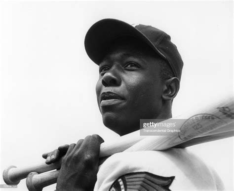 Hank Aaron Outfielder For The Milwaukee Braves Poses With His Bats