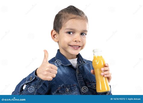 Little Boy Is Drinking Fresh Orange Juice On White Background Stock