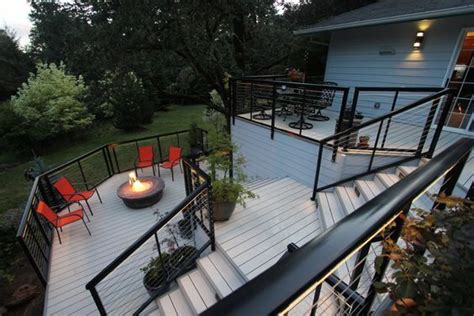 Supply and install aluminum & glass railings and columns, fences and gates. Nextdeck aluminum decking with black cable railings. | Backyard, Aluminum decking, House exterior