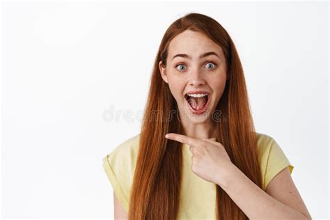 Showing Advertisement Happy Ginger Girl Pointing Finger Left At Logo