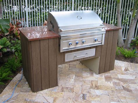 The overall design and style chosen for this project was inspired by examples found on social media. Custom outdoor summer kitchen with granite and faux wood ...