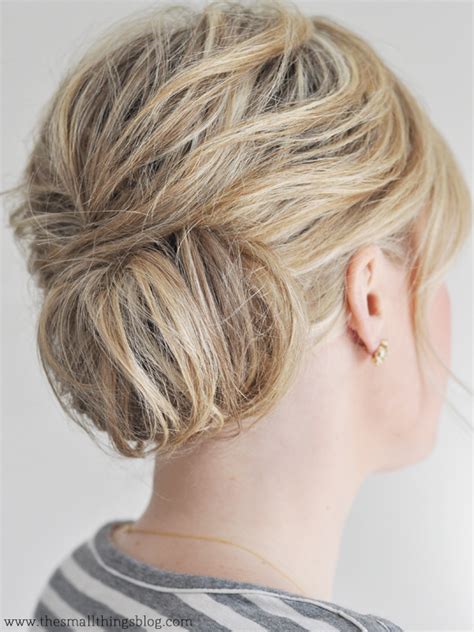 Wavy and lovely, this short hair bun receives a boost from some properly used styling product and a teased under layer. Low Chignon Hair Tutorial - The Small Things Blog
