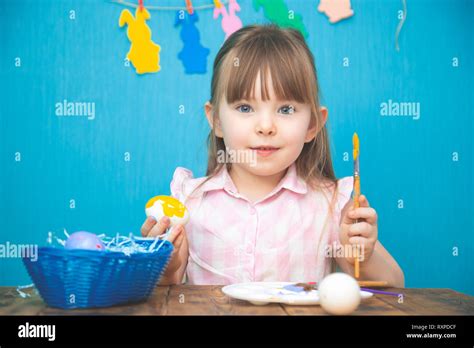 Cute Smiling Little Girl Painting Colorful Easter Eggs Stock Photo Alamy