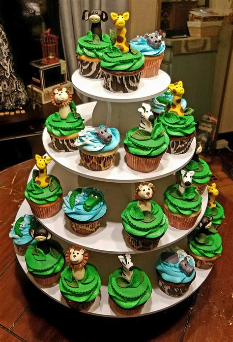 Featuring a sweet and soft color palette that's filled with darling spring florals and little creatures, this event will have you soaring to heights unseen! Safari baby shower cupcakes (With images) | Safari ...