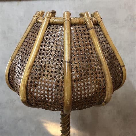 Received the floor lamp (07.28.12) with a large dent on it's base and one of the tulip shades shattered. Rattan Tulip Floor Lamp, 1960s for sale at Pamono