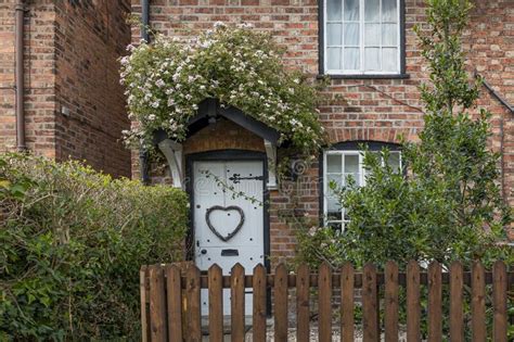 Cottage With Roses Growing Above The Door Stock Image Image Of