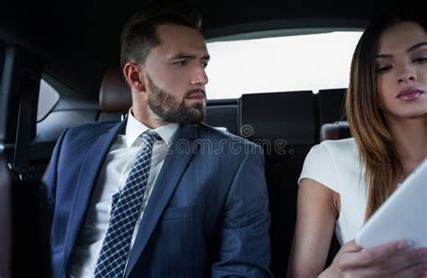 Successful People Working Together In Back Seat Of Car Stock Image Image Of Couple Colleague