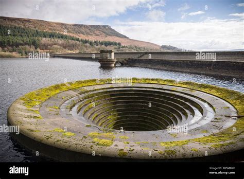 Ladybower Reservoir Dam Wall And Bellmouth Spillway In Winter Peak