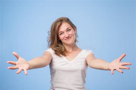 European Woman Raised Up Palms Arms Hands At You Over Blue Background