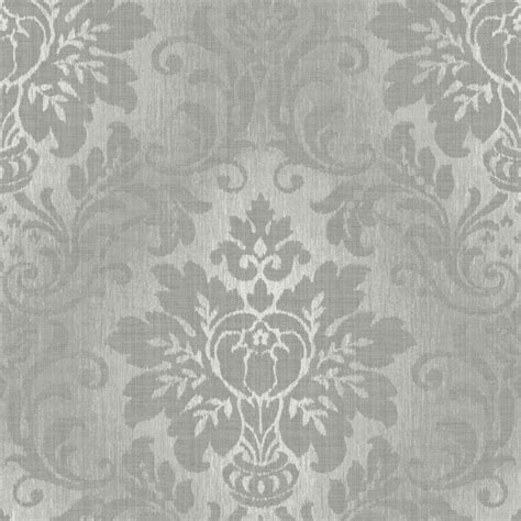 A Silver Glitter Wallpaper Incorporating A Damask Pattern On To A