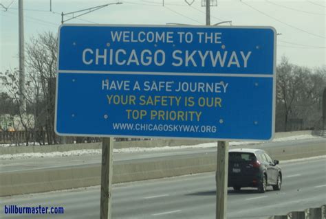 A Welcome Sign At The Entrance To A Ramp From A Surface Street To The