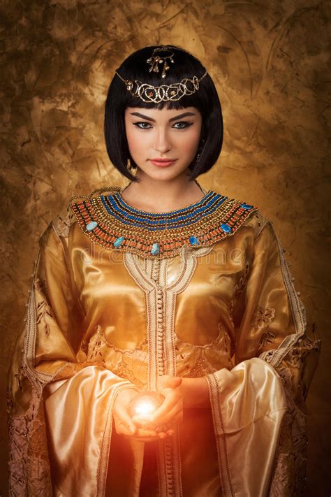Beautiful Egyptian Woman Like Cleopatra With Magic Ball On Golden