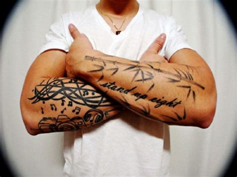 All right here, right now!! Cool Tribal Words Tattoo On Forearms - Inofashionstyle.com