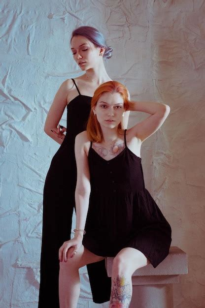 premium photo twins in black dresses