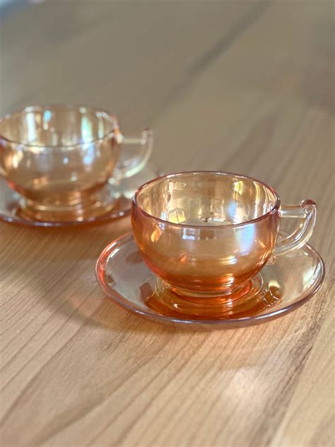 Vintage Jeannette Teacups And Saucers Moderne Iridescent Marigold Carnival Peach Glass Coffee