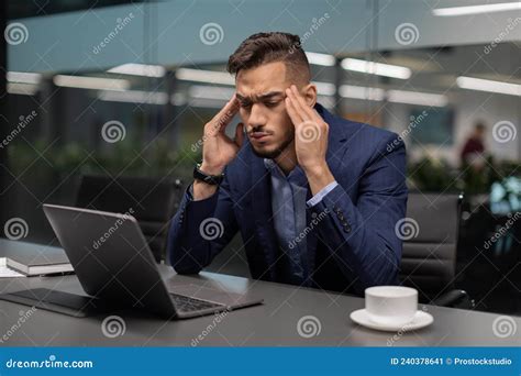 Exhausted Arab Guy Entrepreneur Suffering From Headache Office